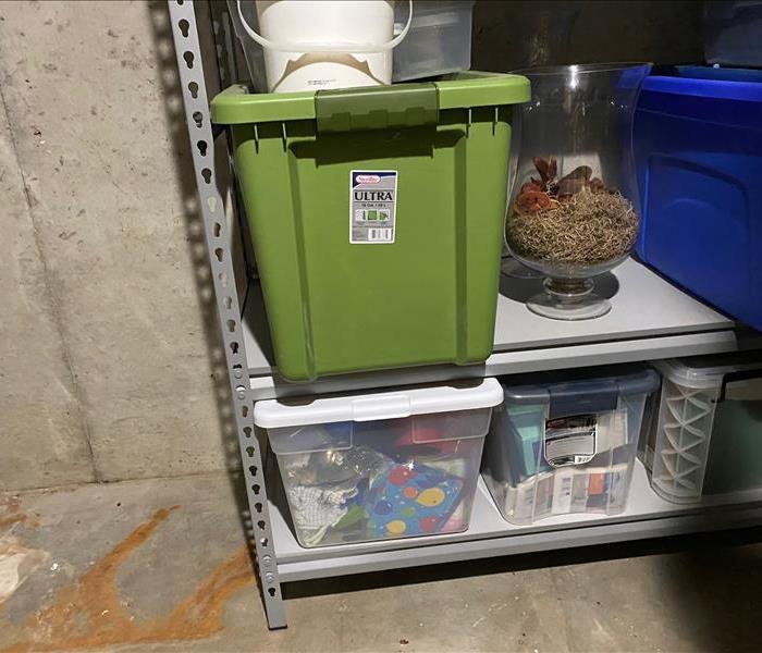 Flooding - image of boxes and containers on shelves