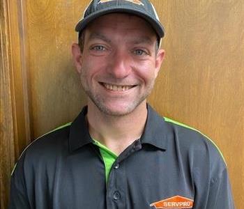 Male Production Tech in black SERVPRO shirt